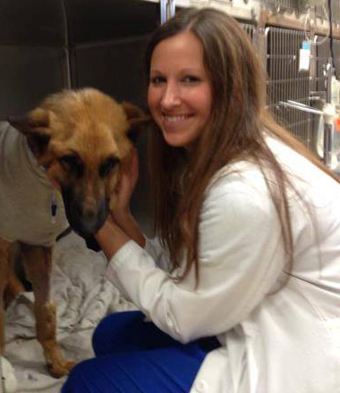 Dr. Erica Bello with a sick dog