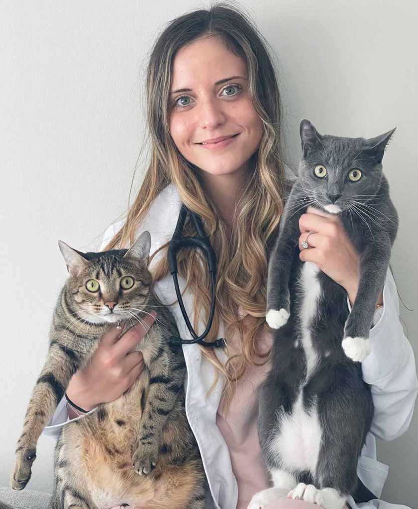 Dr. De Leonibus a Veterinarian with two healthy pet cats